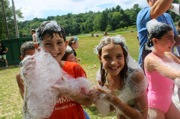 Campers playing with bubbles.