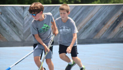 Campers playing hockey.