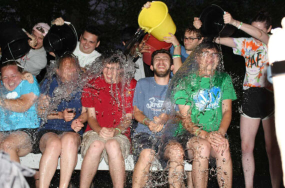 Staff members getting splashed with water.
