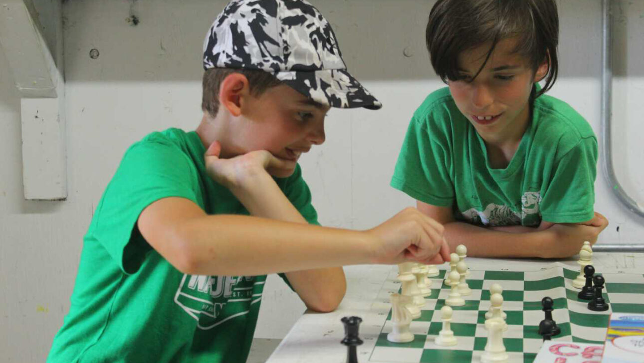 Two campers playing chess.