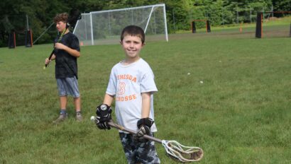 Campers playing lacrosse.