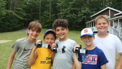 A group of campers using video cameras.