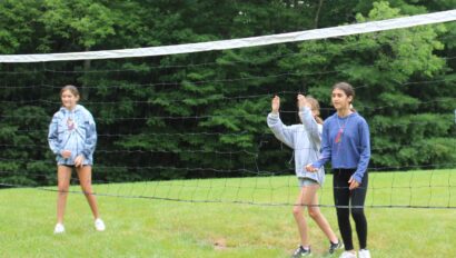 Campers playing volleyball.